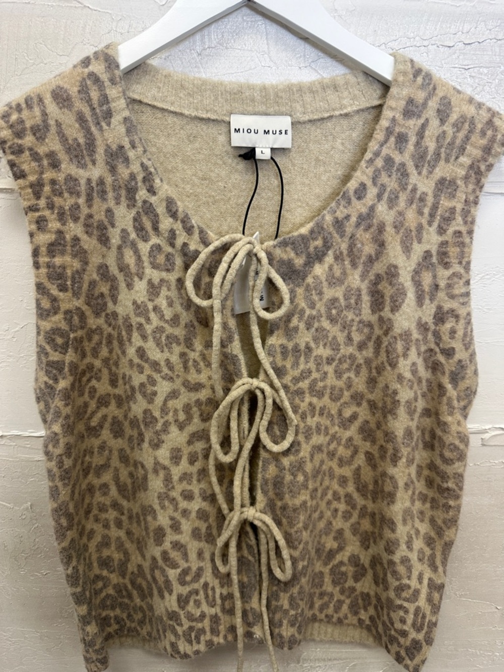 New w tags. Sweater vest open tie. Miou Muse. Size large. Leopard cheetah